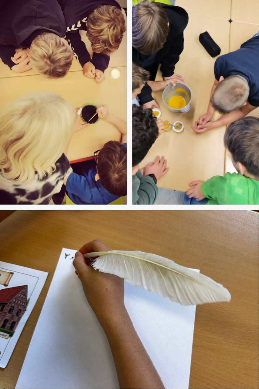 Mehrere Kinder sitzen an einem Tisch und beobachten Gefäße mit Flüssigkeiten, darunter ein Kind, das mit einer weißen Feder auf einem weißen Blatt Papier schreibt.
